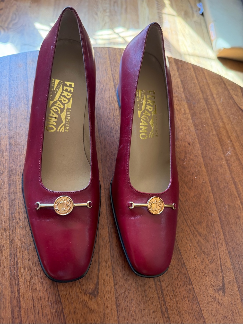 Salvatore Ferragamo Burgundy Leather Pumps with Gold Medallion